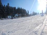 De bovenste helling in volle lengte