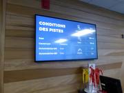 Digitale displays bij de Guest Services