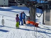 Hulp bij het instappen in de sleeplift