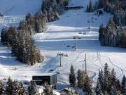 Schwandenbahn - 8-persoons hogesnelheidsstoeltjeslift (koppelbaar) met kap en stoelverwarming