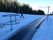 Tovermat/transportband bij het middenstation