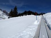 Transportband en oefenpiste bij Trübsee