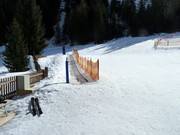 Sunkid transportband bij de dorplift in Feichten