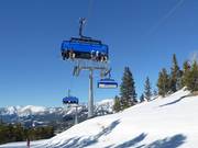 Ramcharger 8 - 8-persoons hogesnelheidsstoeltjeslift (koppelbaar) met kap en stoelverwarming