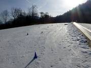 Transportband bij het dalstation van de 4-persoons stoeltjeslift