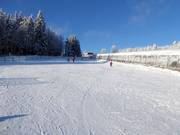 Oefengebied Junior Ski Zirkus met overdekte transportbanden