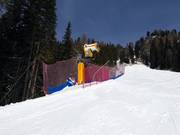 Krachtige sneeuwkanon bij de dalafdaling naar Pozza di Fassa