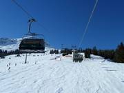 Schlegelkopfbahn 1 - 4-persoons hogesnelheidsstoeltjeslift (koppelbaar) met kap en stoelverwarming